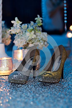 Golden Chantell Heels with a decorated background