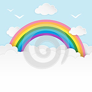 Light blue cloudscape background with birds silhouettes and rainbow. Cloudy soft landscape background with copy-space.