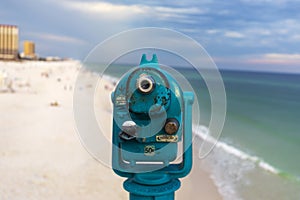 Light blue coin operated telescope mounted on the Pensacola fishing pier