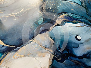 Light blue and dark blue abstract backgroud made with alcohol ink and gold pigment