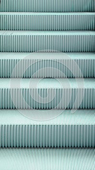 Light blue escalator pattern, close-up step, texture