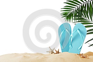 Light blue flip flops and starfishes on sand against background. Beach objects