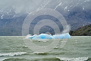 Light blue iceberg on lake Grey at Torres del Paine national park.