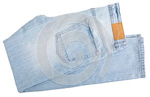 Light blue jeans with tag. Isolated.