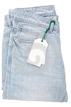 Light blue jeans with tag. Isolated.