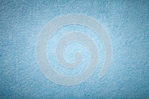 Light blue matt suede fabric closeup. Velvet texture of felt