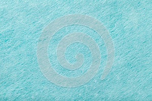 Light blue matt suede fabric closeup. Velvet texture of felt