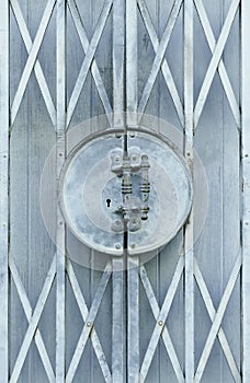 Light blue old metal grille sliding door