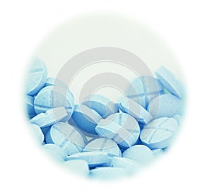 Light blue pill in round box on a isolated white background