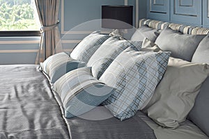 Light blue pillows in difference pattern with classic style bedding