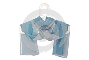Light blue silk scarf on white background, double-sided neckscarf, isolated women`s accessories, draped girl`s accessory on coat