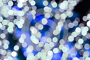 Light blue and silver lights festive decor, lots of blur spots background festive pattern
