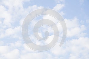 Light blue sky with clouds - abstract background .
