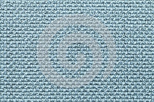 Light blue textile background with checkered pattern, closeup. Structure of the fabric macro.