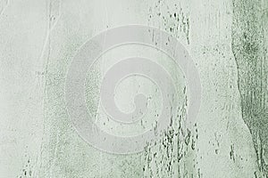Light blue textured concrete background with light base darker in the recesses. Abstract texture for graphic design or