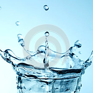 light blue transparent water wave surface with splash bubble on water