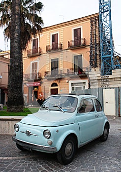 Vintage Fiat 500 car parked in old town of Foggia, Italy