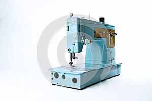 light blue vintage sewing machine on white background