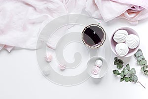 light breakfast with marsh-mallow and coffee on white table background top view