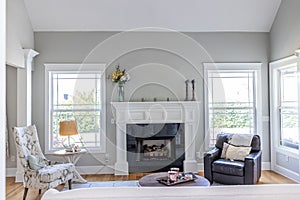 A light and bright open concept living room den with vaulted ceilings in a new construction house