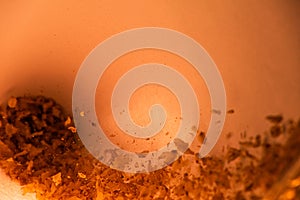 Light brown abstract background with falling buckwheat is macro, soft focus