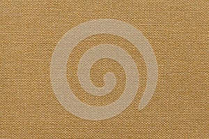 Light brown background from a textile material with wicker pattern, closeup.
