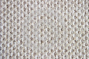 Light brown background with a wicker pattern, closeup