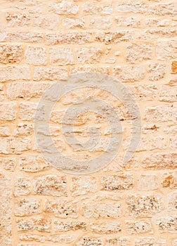 Light brown beige stone wall background texture