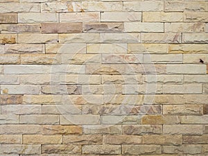Light brown brick stone wall texture. For background.