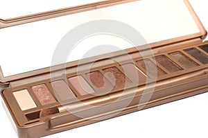 A light brown eye shadow cosmetic palette kit