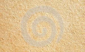 Light brown fibrous kraft paper texture close up