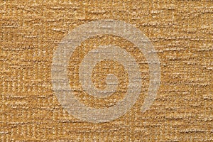 Light brown fluffy background of soft, fleecy cloth. Texture of textile closeup.