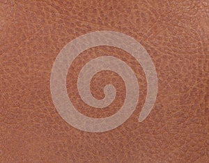 Light brown leather background from a textile material. Fabric with natural texture. Backdrop.