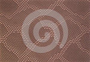 Light brown leather texture background with pattern, closeup. Reptile skin. Beige skin of a crocodile or a snake with