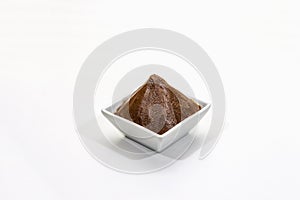 Light brown miso paste isolated on white background. Traditional Japanese seasoning, indispensable ingredient for cooking soup