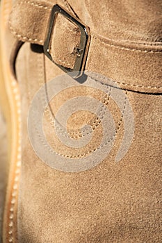 Men`s suede leather shoe close up with buckle