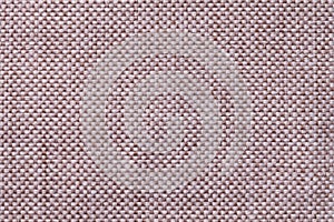 Light brown textile background with checkered pattern, closeup. Structure of the fabric macro.