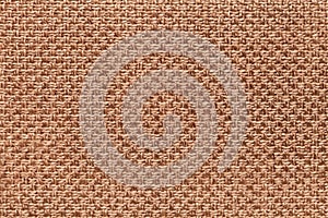 Light brown textile background with checkered pattern, closeup. Structure of the fabric macro.