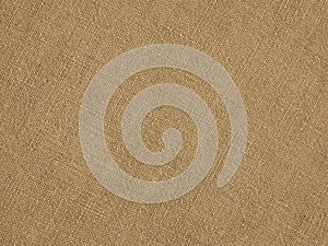 Light brown woven surface closeup. Linen textile texture. Fabric sewing elegant background. Textured braided home backdrop. Len