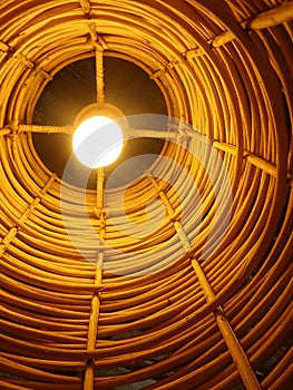 Light bulb in bamboo shade