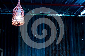 Light bulb in the bamboo weave.