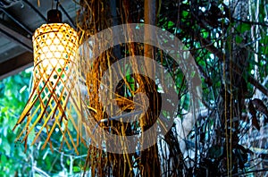 Light bulb in the bamboo weave.