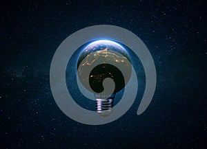 Light bulb blue planet Earth with glow of night cities in space. Electrification, creative idea. Earth energy and global warming.