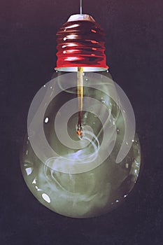 Light bulb with burnt matchstick inside photo