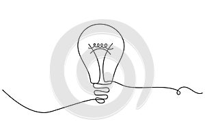 Light bulb continuous one line drawing on white background