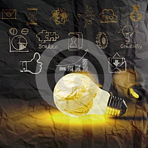 Light bulb 3d on business strategy on crumpled paper background