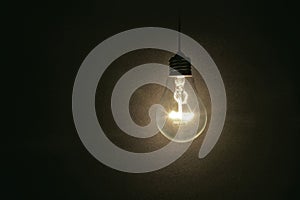 Light bulb on dark background