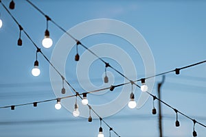 Light bulb decor on blue sky background