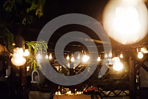 Light bulb decor in outdoor party. Wedding