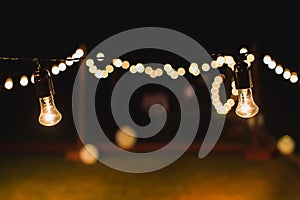 Light bulb decor in a street party at night.